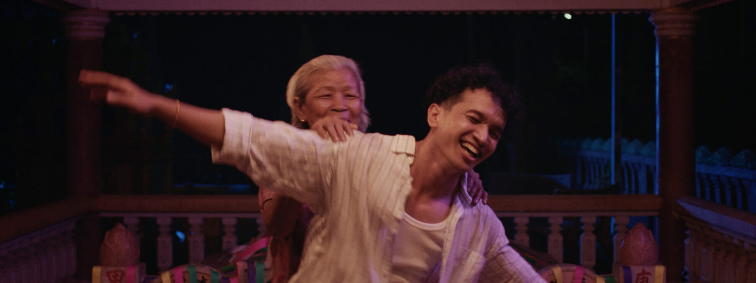 Two people dancing inside.