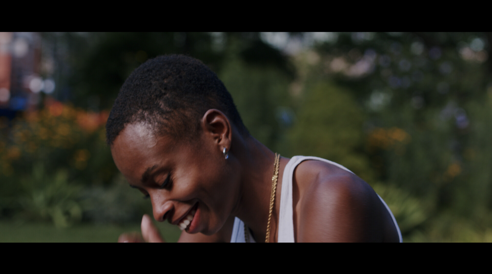 Close up of person smiling looking down.